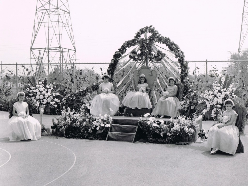 May Festival, 1956. Queen Beverly Jessee with (left) Princess Linda O’Toole left, and (right) Sue Burns. The two girls off stage are unidentified.